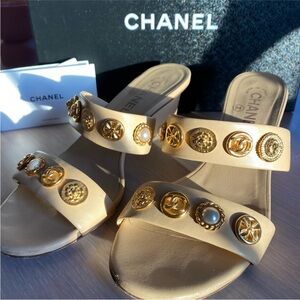CHANEL Women's Cream Sandals with Gold Embellishments